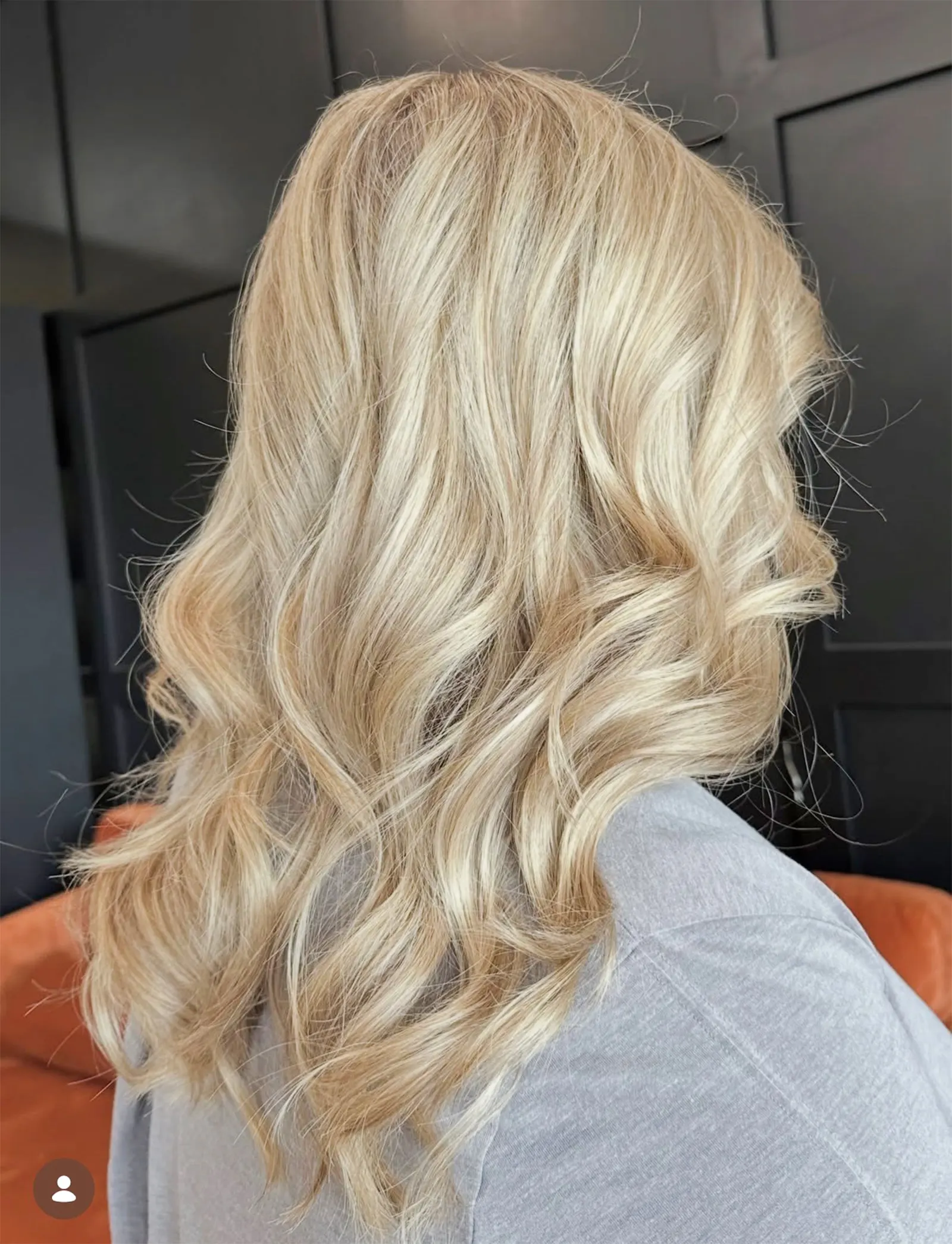 Dimensional blonde balayage with soft waves at Muse Hair Studio in Powell, Ohio